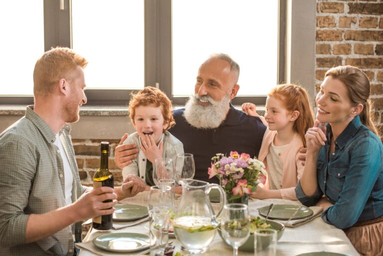 happy family having conversation during family dinner at home