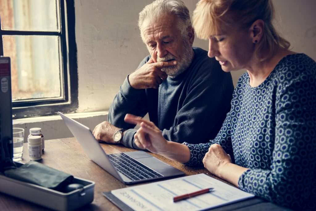 Elderly couple researching information online