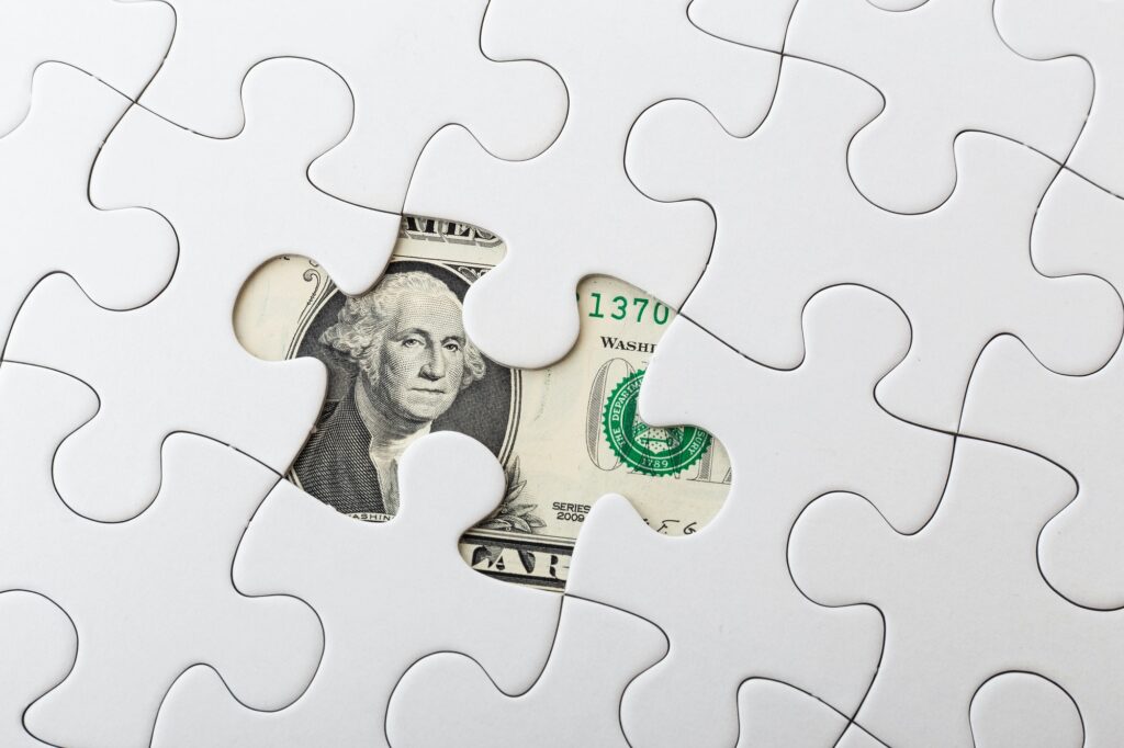 US dollar banknote and puzzle