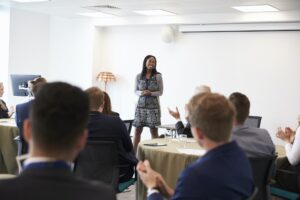 Businesswoman Making Presentation At Conference
