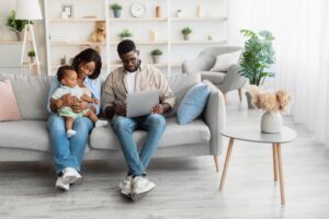 Portrait of african american family using laptop at home